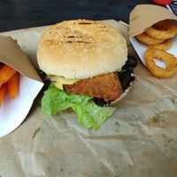 seitan schnitzel with sweet potato fries and onion rings at Vburger Camden in North West London