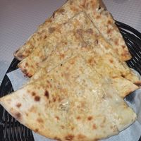 Cheese and mushroom naan at Sanskar Nepal in Lisbon