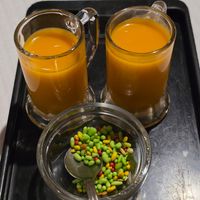 Mango lassi shots with bill at Sanskar Nepal in Lisbon