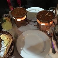 A full table with vegan chicken masala (pot on the left ) at Sanskar Nepal in Lisbon