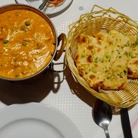 Vegan chicken masala with vegan cheese and garlic bread at Sanskar Nepal in Lisbon