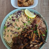 Hoax tail and jerk chicken bowl. Bread pudding at Dajen Eats in Eatonville