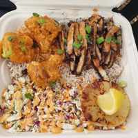 Build A Bowl with buffalo cauliflower,  jerk chick'n , rice and slaw  at Dajen Eats in Eatonville
