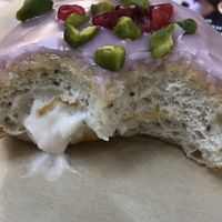 Orange blossom - lovely and gooey inside with poppy seeds in the dough at Crosstown Doughnuts - Shoreditch in East London