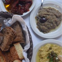 Sundried tomatoes, aubergine purée, garlic purée, bread (all vegan) at Candouni in Santorini