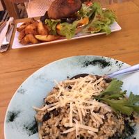 Vegan burger with chips and risotto at Simbiosis in Ibiza