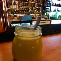 Golden latte and bar area at Dwell in Bergen