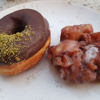Apple fritter and dark chocolate + pistachio doughnut at Holy Donut - Vokiečių in Vilnius