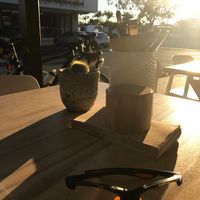 Sunny outdoor eating area at Nude Sisters Whole Food Kitchen in Gold Coast