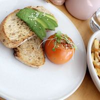 Avo toast & tomato & cheesy fries  at Nude Sisters Whole Food Kitchen in Gold Coast