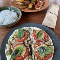 Pesto pizza personal size and lomo saltado, delicious! at Veda Restaurante in Miraflores