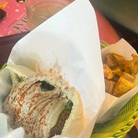 Half pita so covered in hummus there is not much to seee  at Falafel Brothers - Minato in Tokyo