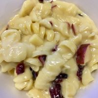 Vegan Mac & Cheese with diced apples and cranberries  at Pit Stop Taproom & Pub in Burien