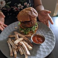 Burger with fries and ketchup at El Grifo in Caguas
