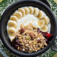 Homemade vegan granola with Greek yogurt or vegan yogurt. at Miranda Cafe in North London