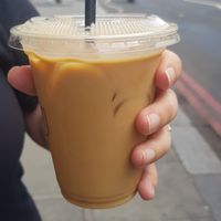 Iced oat decaf latte with caramel syrup 😋 at Over Under Coffee in South West London