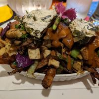 Poutine végane : tofu, légumes, sauce miso et fauxmage vegnature at L'Innocent in Riviere-du-loup