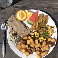Complete vegan breakfast: fruits, curry tofu, veg pate, fauxcheese, potatoes, gluten-free option: the buckwheat crepe! DELICIOUS! Great service & dog friendly on the terrace 💚  at L'Innocent in Riviere-du-loup