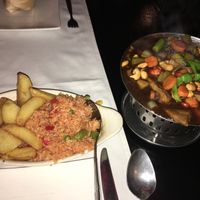 If you order in.. food comes on a sizzling tray with the fire still burning under it.  at Rose Garden in Willemstad