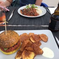 My burger and girlfriend's stew :)  at Veggie Cafe in Albufeira