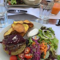 Spaghetti Bolo and a Veggieburger (without bread) with delicious crisps and salad at Veggie Cafe in Albufeira