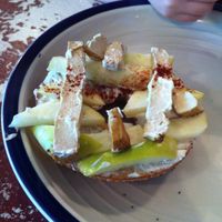 Bagel with apples, cream cheese, and ginger tofu. at The Red and Black Cafe in Portland