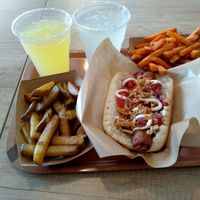drinks, fries and vienna dog at Voodies in Vienna