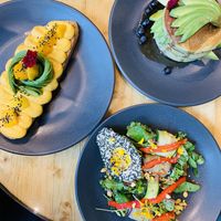 Curry hummus with avocado, pancake with maplesyrup and blueberrys, avocado with greens.  at The Avocado Show - Stalpertstraat in Amsterdam