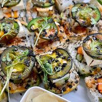 Sweet Potato Tempura, Shiitake Mushrooms & Asparagus
Topped w/ avocado, tofu, seared jalapeños, ankake sauce, cilantro vinaigrette, black sesame & micro greens.  Our favorite!  at Sushi 2 in San Diego