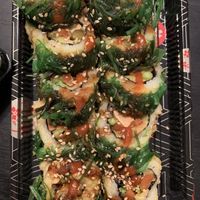 Vegan San Diego Roll (in: tofu, gobo carrots, avocado, asparagus. top: whole roll tempura battered & deep fried, topped with seaweed salad, sweet sauce, sriracha & sesame seeds ) at Sushi 2 in San Diego