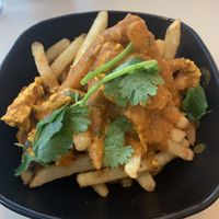 Butter chicken with fries  at Saigon Lotus in Toronto
