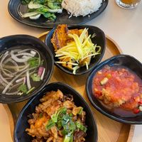 Combo 1 featured: Sweet & Sour Crispy Tofu, BBQ Vegan Meat, Caramel Tofu-Seitan, White Rice, Bok Choy, and Soup at Saigon Lotus in Toronto
