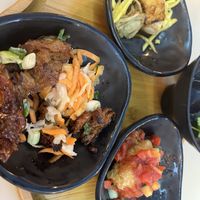 Combo Platter 1:  Sweet and Sour Crispy Tofu;  Bbq Vegan Meat;  Caramel Tofu-Seitan;  Also, came with rice (choice of white or brown) with a side of kimchi, and soup broth.  Yum!  at Saigon Lotus in Toronto