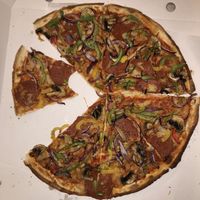 Vegan pepperoni, onion, pepper and mushroom at Village Pizza in Ewell