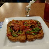 Avocado toast and homemade ice tea at Glad Day Bookshop in Toronto