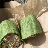 Veggie hummus wrap on a spinach wrap at Lolo Kai Smoothies & Wraps in Galveston