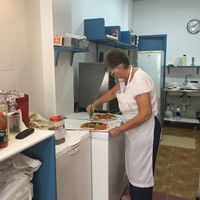 Owner making pizza at Pizzeria La Faina in Malaga