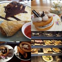 Peanut butter brownie, oreo doughnut, sausage roll, cabinet, berry tart, coconut mocha with marshmallows, and the cabinet. at Portershed in Christchurch