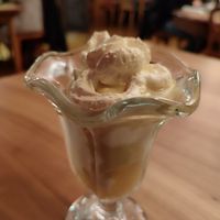 Vanilla ice cream with applesauce, whipped cream and vegan Eierlikör at Blume Wollbach in Kandern