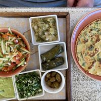 Vegan breakfast with chickpea omelette  at Nimrod Cafe - Port in Tel Aviv