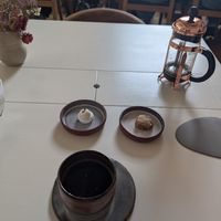 Pavlova, miso carrot cookie, and coffee at Humus x Hortense in Brussels