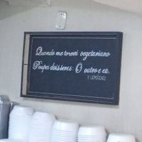 "Quando me torrnei vegetariano, poupei dois seres: o outro e eu" (Hemógenes) [um dos quadros presentes no restaurante] at Vita Natural in Sao Paulo
