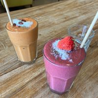 Strawberry Goji Lassi and Berry Breakfast (dates instead of honey) Smoothies   at The Social Society in Exmouth