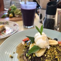 Vegan pancakes, raw treat and avocado on sourdough  at The Social Society in Exmouth