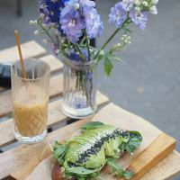 Avocado toast with vegan pesto and iced latte with oat milk at Coffee Room in Prague
