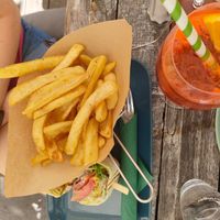 Wrap with guacamole onion tomato and fries at Veggiezz - Opernring in Vienna