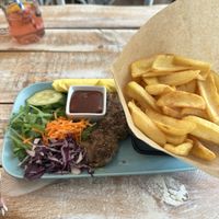 Seitan pepper steak with BBQ sauce and chips  at Veggiezz - Opernring in Vienna