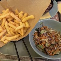 Stir fried/sautéed veggies with a side of chips  at Veggiezz - Opernring in Vienna