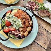 Seitan chicken bowl with cucumber tzatziki and seitan pepper steak   at Veggiezz - Opernring in Vienna