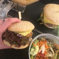 farmers burger with a side salad at Veggiezz - Opernring in Vienna